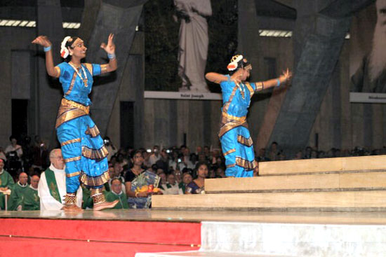 Two women performing Hindu Tamil dances in the Sanctuary of Our Lady of Lourdes